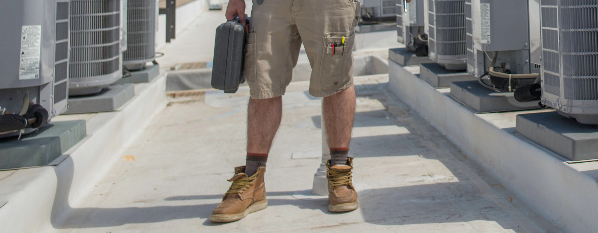 a person holding a toolbox ready for hvac services